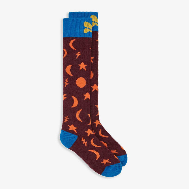 Puddlestomper Welly Socks Purple: Two purple welly socks with moon, star and lightening bolt patterns with blue cuff and toe detail are displayed.